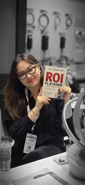 Reader with The Exhibition ROI Playbook 2
